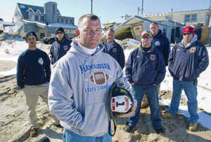 Jay Price ’93 (center) led a squad of firefighters on water rescues when Hurricane Sandy struck his hometown of Manasquan, NJ. Behind him are the members of his rescue team.