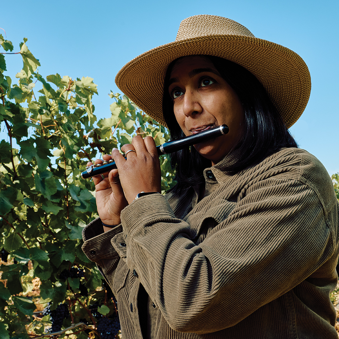 Winemaker Shalini Sekhar plays a piccolo at Ricci Vineyard in Sonoma, California
